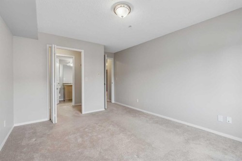 7207-304 Mackenzie Way Sw, Airdrie, AB - Indoor Photo Showing Other Room