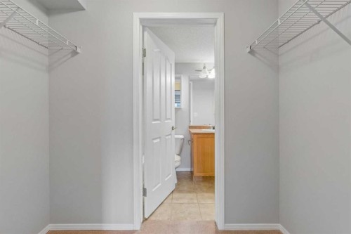 7207-304 Mackenzie Way Sw, Airdrie, AB - Indoor With Storage
