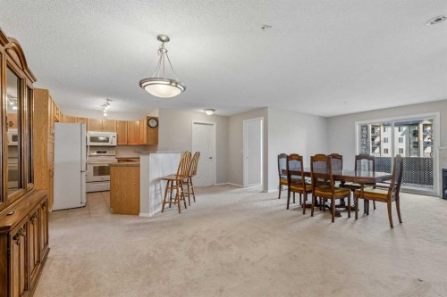 7207-304 Mackenzie Way Sw, Airdrie, AB - Indoor Photo Showing Dining Room