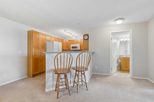 7207-304 Mackenzie Way Sw, Airdrie, AB - Indoor Photo Showing Dining Room