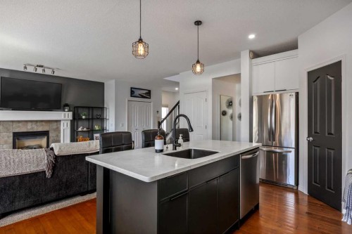 5 Copperpond Link Se, Calgary, AB - Indoor Photo Showing Kitchen With Fireplace With Upgraded Kitchen