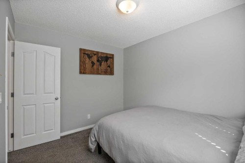 5 Copperpond Link Se, Calgary, AB - Indoor Photo Showing Bedroom