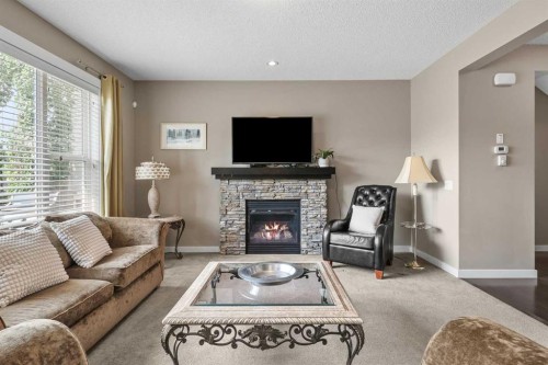 4728 Elgin Avenue Se, Calgary, AB - Indoor Photo Showing Living Room With Fireplace
