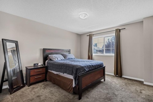 54 Autumn View Se, Calgary, AB - Indoor Photo Showing Bedroom