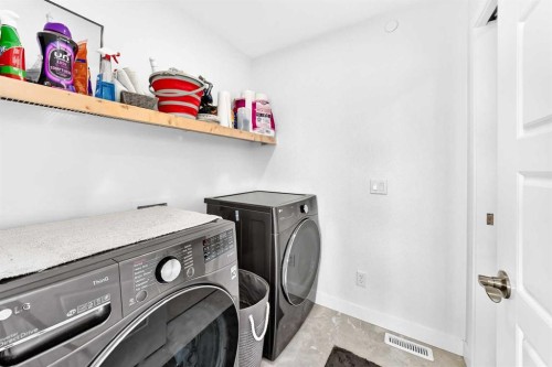 142 Lucas Terrace Nw, Calgary, AB - Indoor Photo Showing Laundry Room