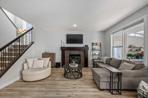 58 Copperstone Close Se, Calgary, AB - Indoor Photo Showing Living Room With Fireplace