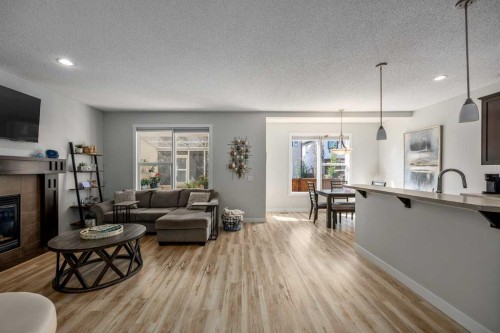 58 Copperstone Close Se, Calgary, AB - Indoor Photo Showing Living Room With Fireplace