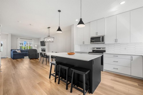 102 Midgrove Sw, Airdrie, AB - Indoor Photo Showing Kitchen With Upgraded Kitchen