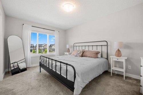 102 Midgrove Sw, Airdrie, AB - Indoor Photo Showing Bedroom