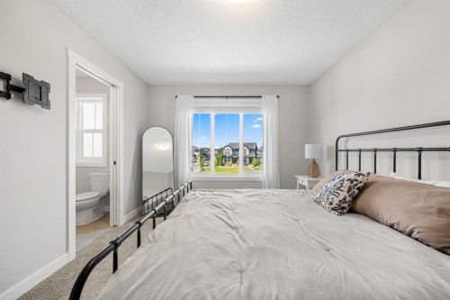 102 Midgrove Sw, Airdrie, AB - Indoor Photo Showing Bedroom