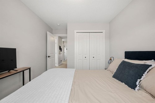 102 Midgrove Sw, Airdrie, AB - Indoor Photo Showing Bedroom