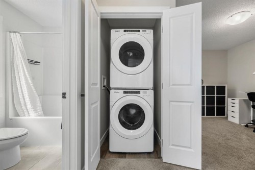 102 Midgrove Sw, Airdrie, AB - Indoor Photo Showing Laundry Room