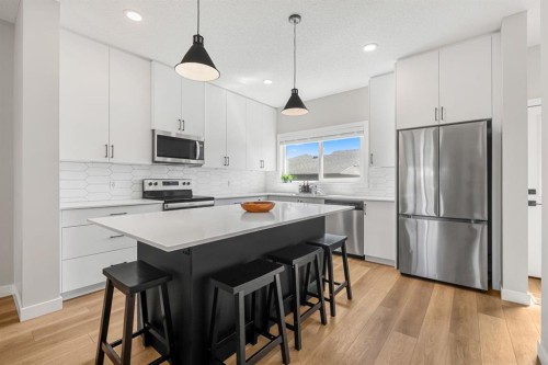 102 Midgrove Sw, Airdrie, AB - Indoor Photo Showing Kitchen With Stainless Steel Kitchen With Upgraded Kitchen