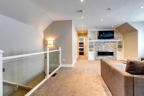 337 3 Avenue Ne, Calgary, AB - Indoor Photo Showing Other Room With Fireplace