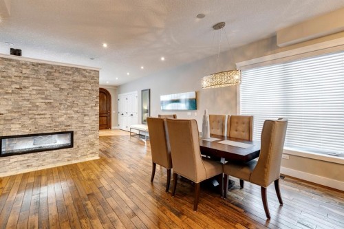 337 3 Avenue Ne, Calgary, AB - Indoor Photo Showing Dining Room With Fireplace