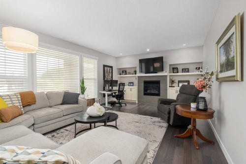185 Cranbrook Villas Se, Calgary, AB - Indoor Photo Showing Living Room With Fireplace