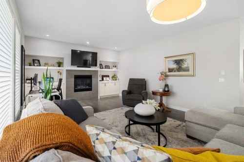 185 Cranbrook Villas Se, Calgary, AB - Indoor Photo Showing Living Room With Fireplace