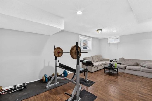 80 Pensville Road Se, Calgary, AB - Indoor Photo Showing Gym Room
