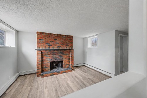 4004 79 Street Nw, Calgary, AB - Indoor Photo Showing Living Room With Fireplace
