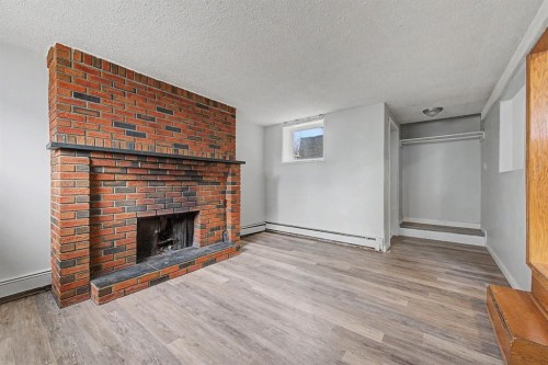 4004 79 Street Nw, Calgary, AB - Indoor Photo Showing Living Room With Fireplace