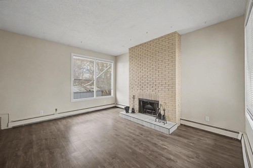 4004 79 Street Nw, Calgary, AB - Indoor Photo Showing Other Room With Fireplace