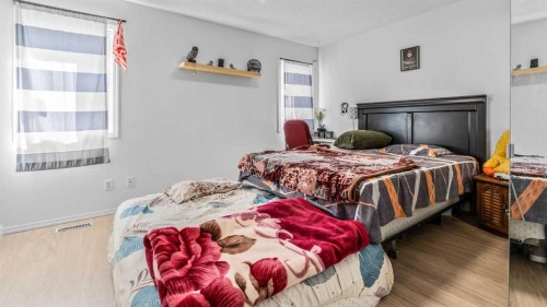 247 Taracove Estate Drive Ne, Calgary, AB - Indoor Photo Showing Bedroom