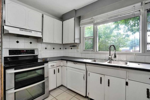 5404 Valentine Crescent Se, Calgary, AB - Indoor Photo Showing Kitchen With Double Sink