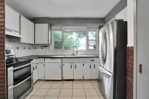 5404 Valentine Crescent Se, Calgary, AB - Indoor Photo Showing Kitchen With Double Sink