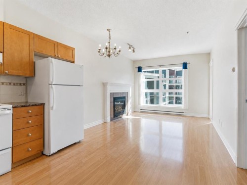 317-333 Riverfront Avenue Se, Calgary, AB - Indoor Photo Showing Kitchen With Fireplace