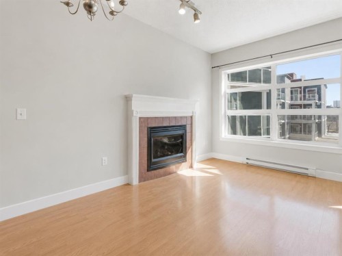 317-333 Riverfront Avenue Se, Calgary, AB - Indoor Photo Showing Living Room With Fireplace