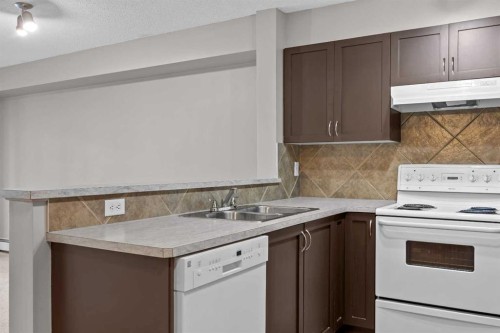 9216-70 Panamount Drive Nw, Calgary, AB - Indoor Photo Showing Kitchen With Double Sink