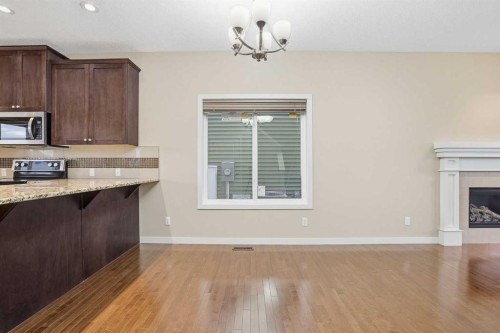 37 Nolanfield Manor Nw, Calgary, AB - Indoor Photo Showing Kitchen With Fireplace