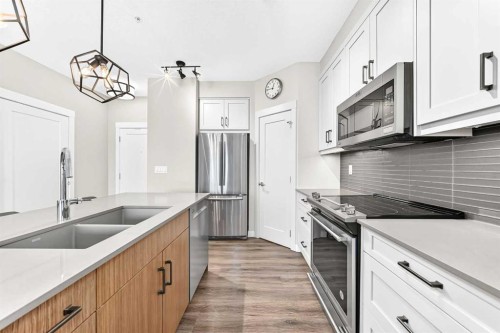 120-10 Walgrove Se, Calgary, AB - Indoor Photo Showing Kitchen With Stainless Steel Kitchen With Double Sink With Upgraded Kitchen