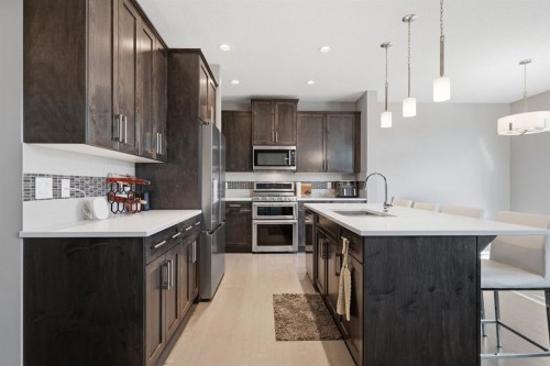 2632 Ravenslea Gardens Se, Airdrie, AB - Indoor Photo Showing Kitchen With Upgraded Kitchen
