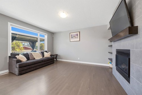 2632 Ravenslea Gardens Se, Airdrie, AB - Indoor Photo Showing Living Room With Fireplace