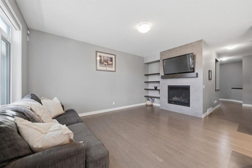 2632 Ravenslea Gardens Se, Airdrie, AB - Indoor Photo Showing Living Room With Fireplace