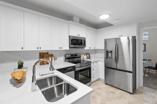 239 Lewiston Drive Ne, Calgary, AB - Indoor Photo Showing Kitchen With Double Sink