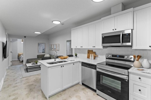 239 Lewiston Drive Ne, Calgary, AB - Indoor Photo Showing Kitchen With Double Sink