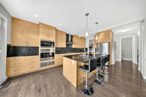 37 Rainbow Falls Boulevard, Chestermere, AB - Indoor Photo Showing Kitchen With Upgraded Kitchen