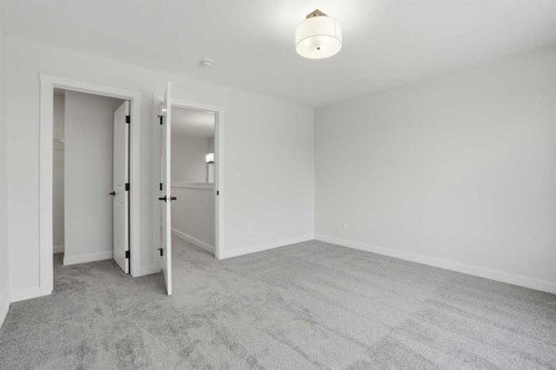 92 Buffaloberry Manor Se, Calgary, AB - Indoor Photo Showing Other Room