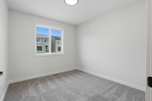 92 Buffaloberry Manor Se, Calgary, AB - Indoor Photo Showing Other Room
