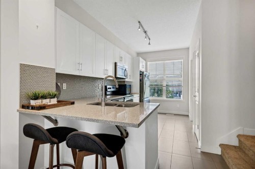 42 Sherwood Row Nw, Calgary, AB - Indoor Photo Showing Kitchen With Double Sink