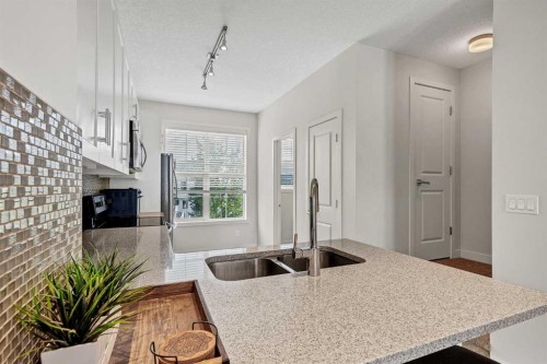 42 Sherwood Row Nw, Calgary, AB - Indoor Photo Showing Kitchen With Double Sink