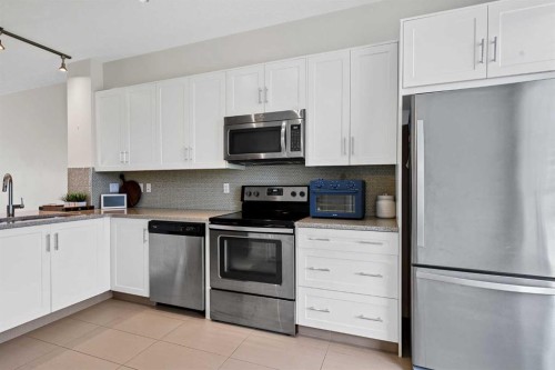 42 Sherwood Row Nw, Calgary, AB - Indoor Photo Showing Kitchen With Stainless Steel Kitchen