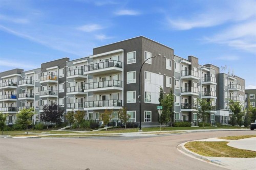 2306-33 Carringham Gate Nw, Calgary, AB - Outdoor With Balcony With Facade