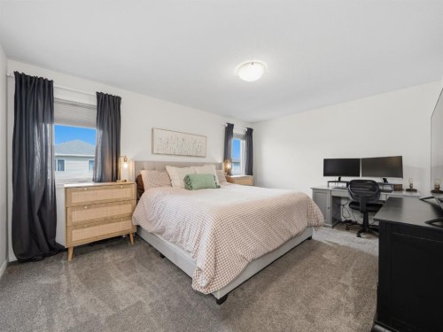 414 Windrow Common Sw, Airdrie, AB - Indoor Photo Showing Bedroom