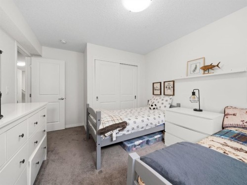 414 Windrow Common Sw, Airdrie, AB - Indoor Photo Showing Bedroom