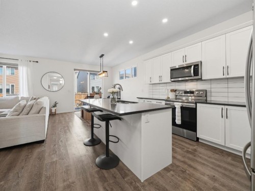 414 Windrow Common Sw, Airdrie, AB - Indoor Photo Showing Kitchen With Stainless Steel Kitchen With Upgraded Kitchen