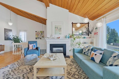 111 Coachwood Crescent Sw, Calgary, AB - Indoor Photo Showing Living Room With Fireplace