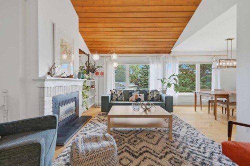111 Coachwood Crescent Sw, Calgary, AB - Indoor Photo Showing Living Room With Fireplace